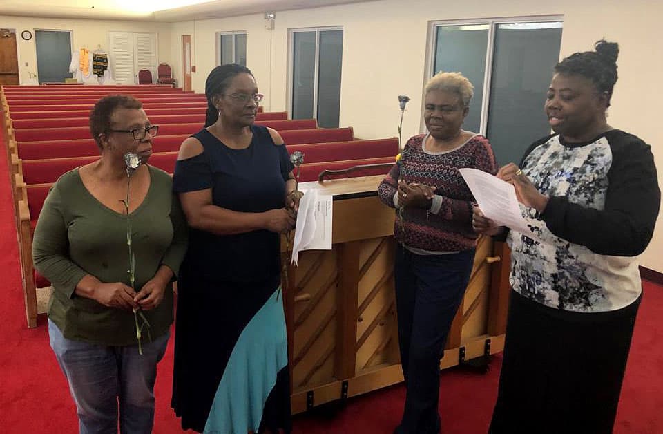 Dr. Judith-Pierre Okerson (far right) began investing in the Florida United Methodist Foundation’s Development Fund 10 years ago. Her investments, added to those of more than 1,700 other investors, make loans from the fund to churches and agencies possible. Her own church, Miramar United Methodist Church, received loans to hurricane-proof windows and repair the roof. (FUMF photo)