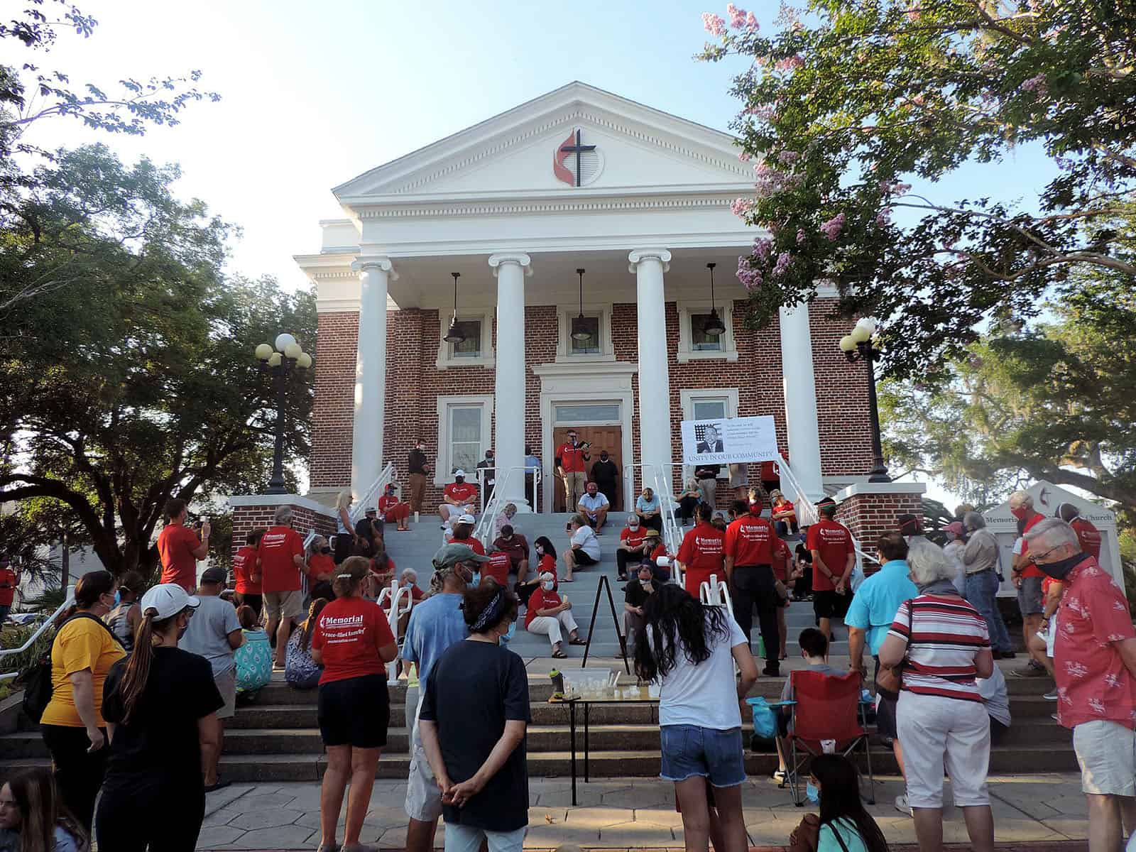 Residents participate in a community vigil of solidarity and hope May 31 at Memorial United Methodist Church in Fernandina Beach. The church is one of 66 that took advantage of the option to pay interest only on their Development Fund loan from the foundation during the COVID-19 outbreak. (MUMC photo)